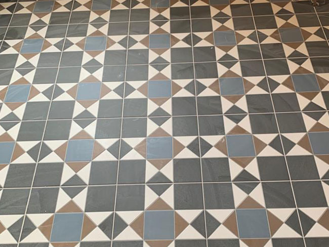 Victorian tiled bathroom floor and walls