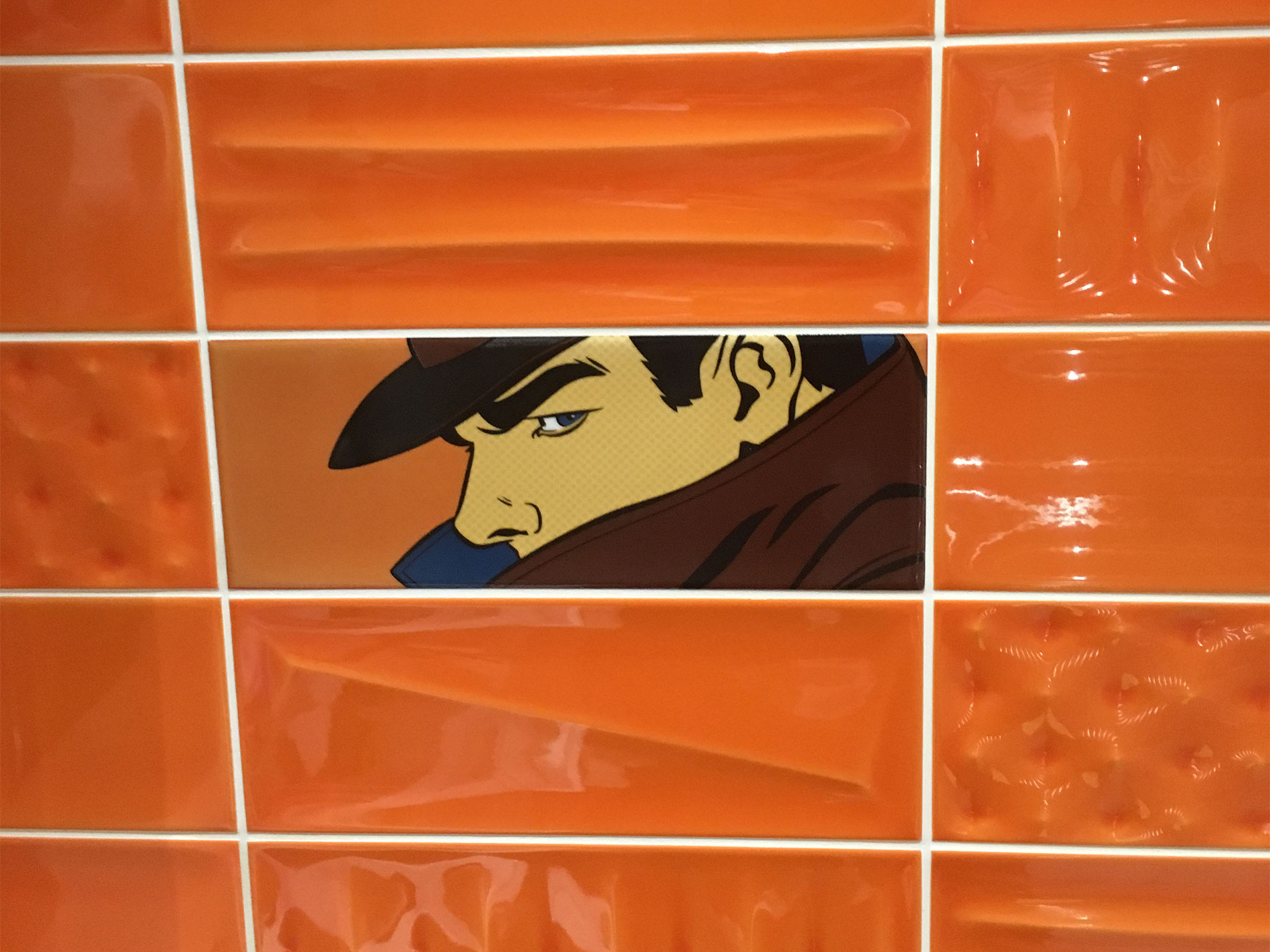 Cartoon tiled wall in bathroom